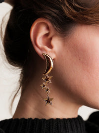 Cosmic Earrings — Gold moon & star earrings on model detail — MYFASHIONFRUIT
