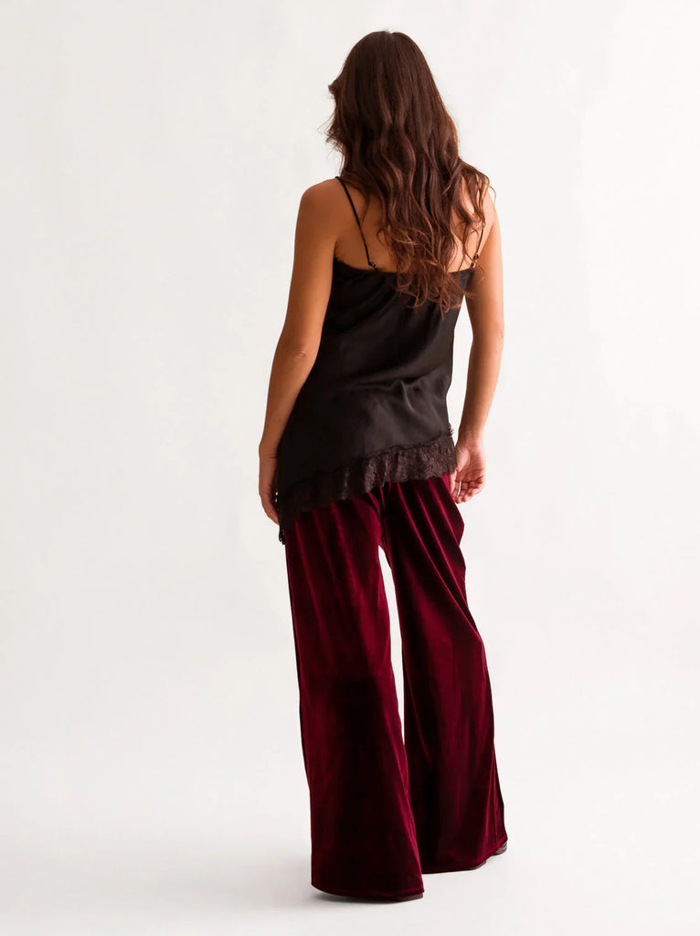 Morena Pants — Model wearing velvet maroon pants and black top — MYFASHIONFRUIT