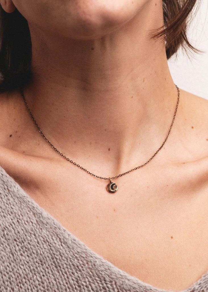 Tiny Crescent Moon Pendant — Gold moon pendant on model — MYFASHIONFRUIT