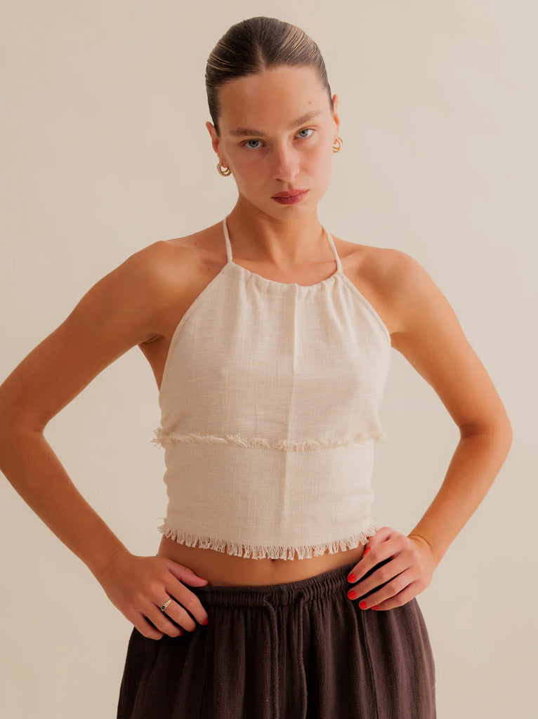 Amaya Top — Beige halter top with fringe details, on model — MYFASHIONFRUIT