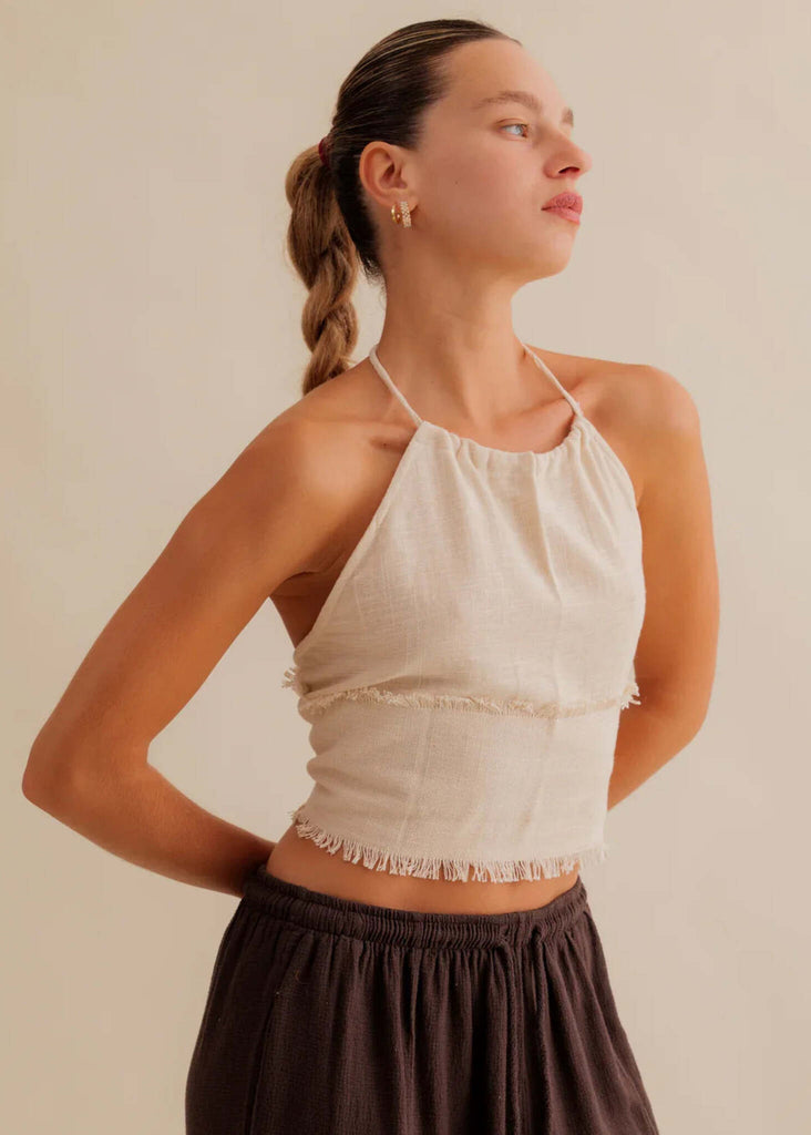 Amaya Top — Beige halter top with fringe detail on model — MYFASHIONFRUIT
