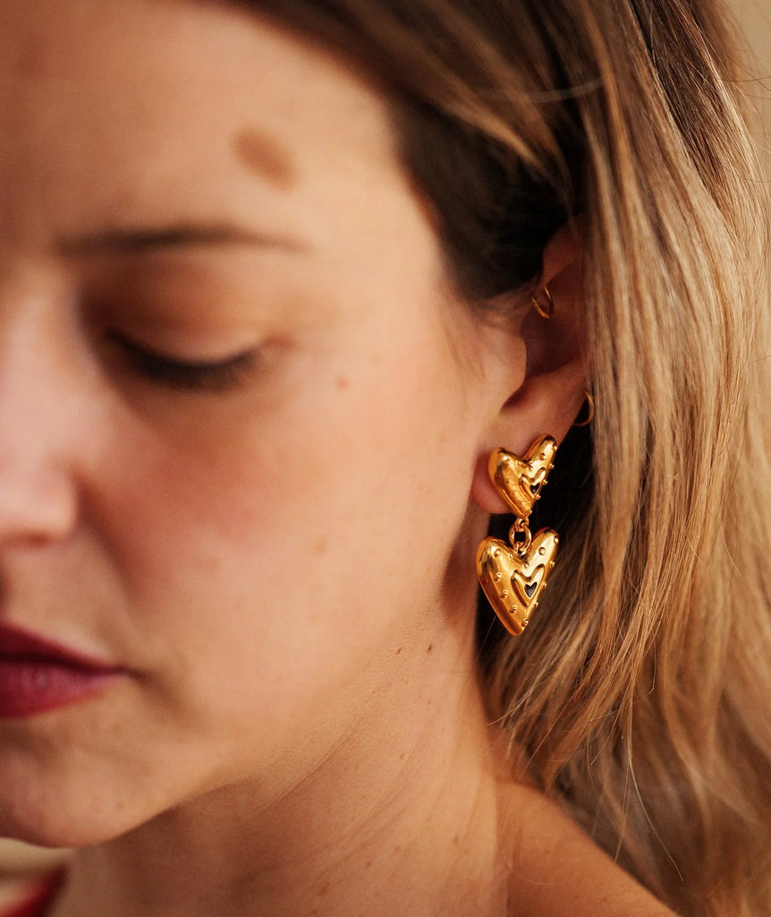 Amora Earrings — Gold heart earrings on model — MYFASHIONFRUIT