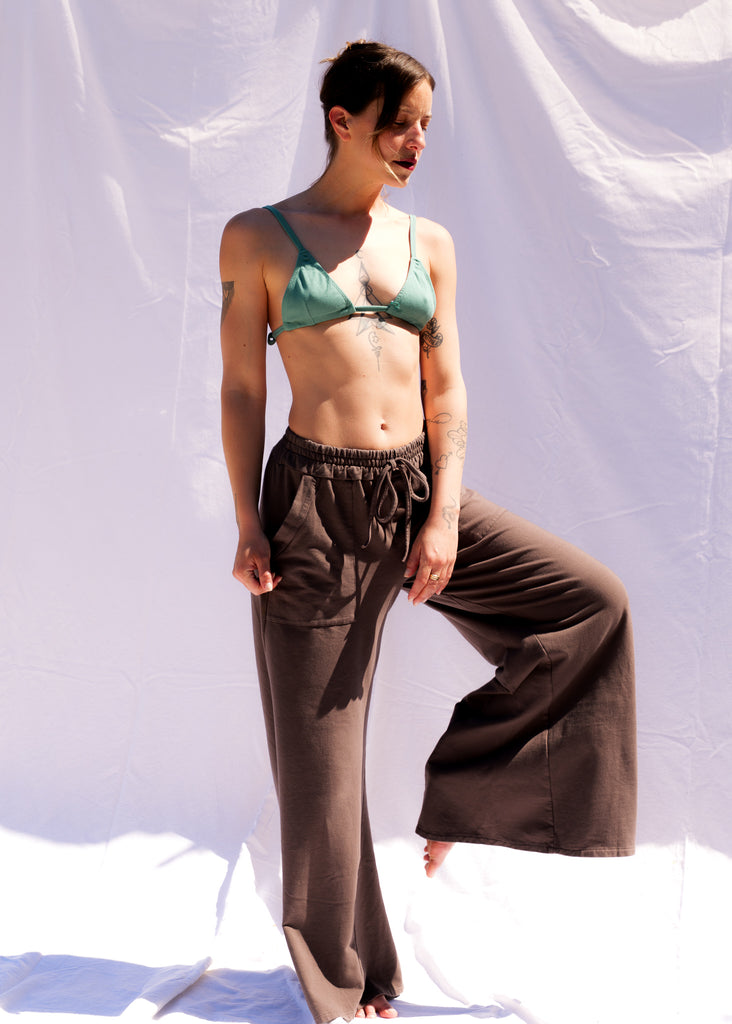 Serenity Wide Sweatpants — Brown sweatpants and green bra on model — MYFASHIONFRUIT