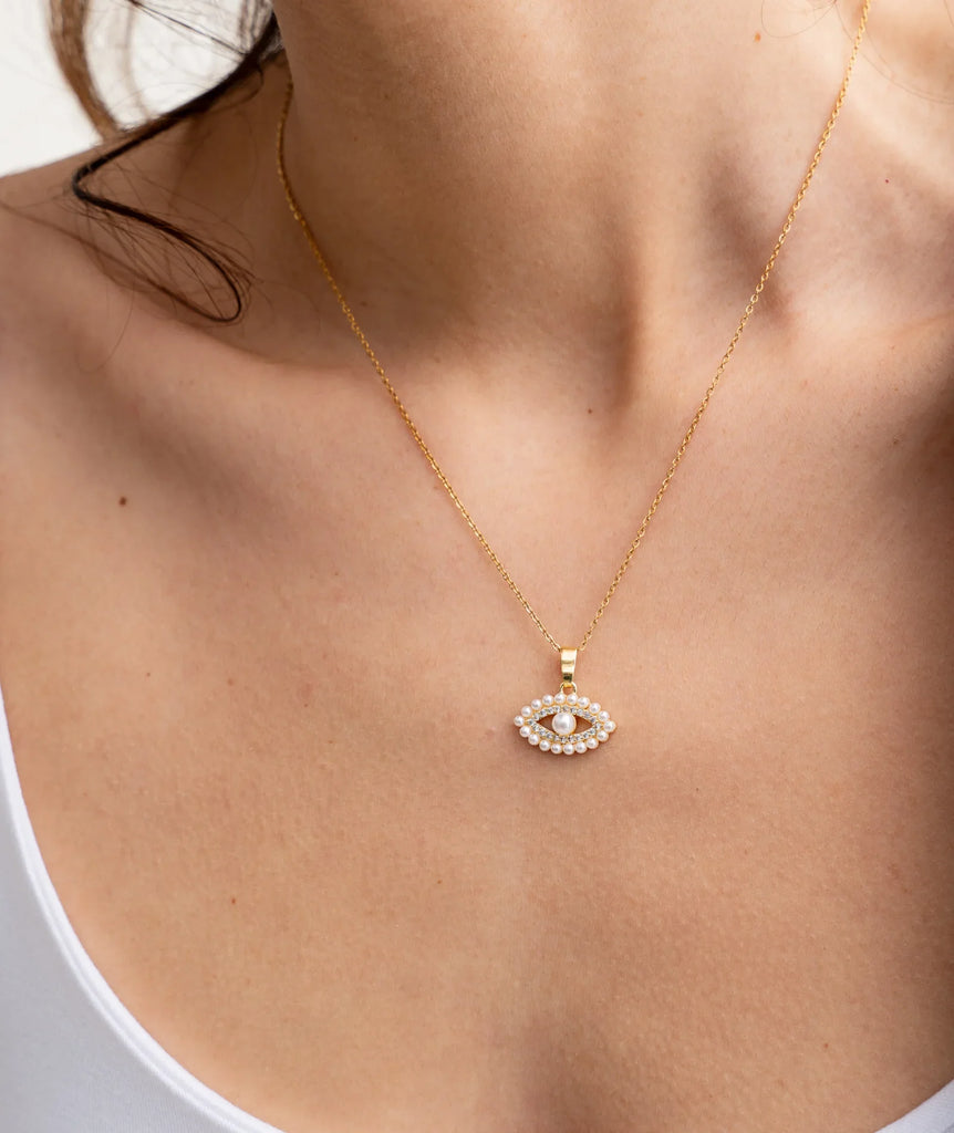 Lora Necklace — Gold chain with pearl evil eye on model — MYFASHIONFRUIT