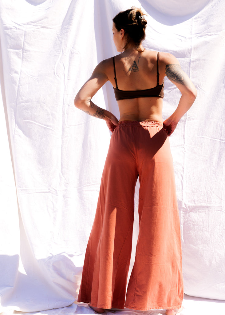 Serenity Wide Sweatpants — Rust-colored wide sweatpants on model — MYFASHIONFRUIT