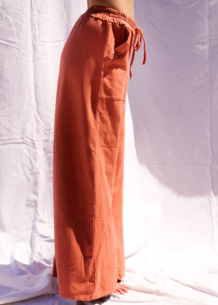 Serenity Wide Sweatpants — Rust-colored wide-leg sweatpants on model — MYFASHIONFRUIT