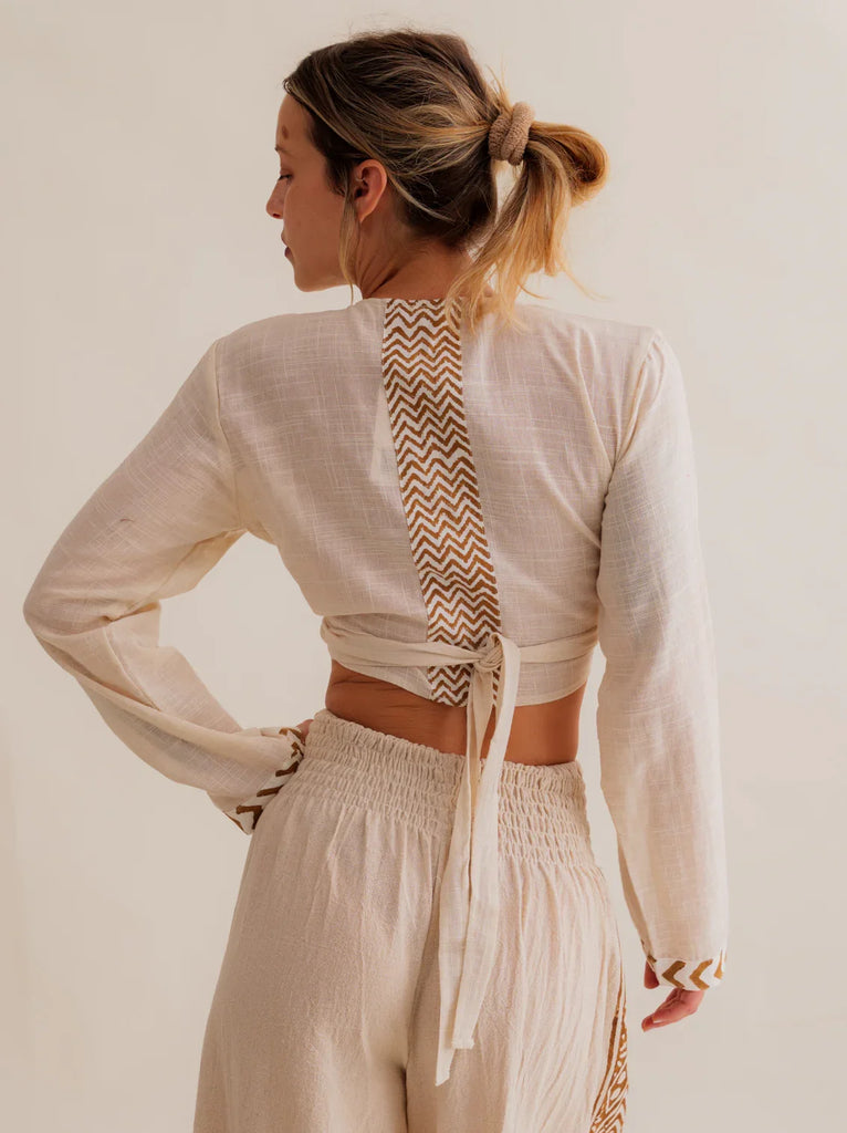 Zoe Wrap Top — Beige wrap top with brown details on model — MYFASHIONFRUIT