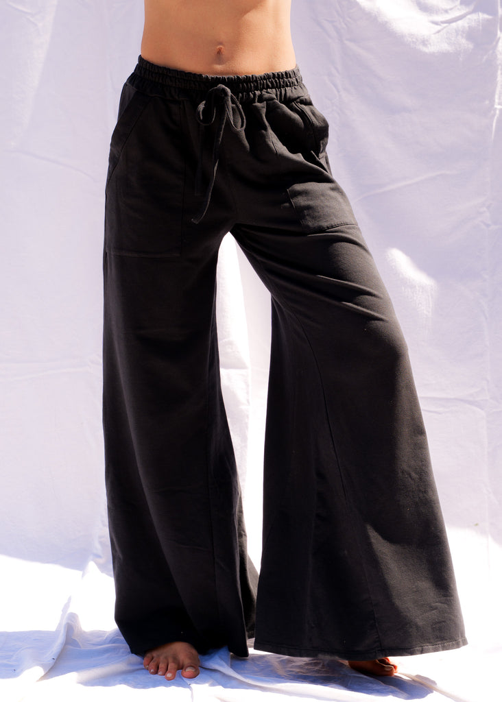 Serenity Wide Sweatpants — Black wide-leg sweatpants on model — MYFASHIONFRUIT