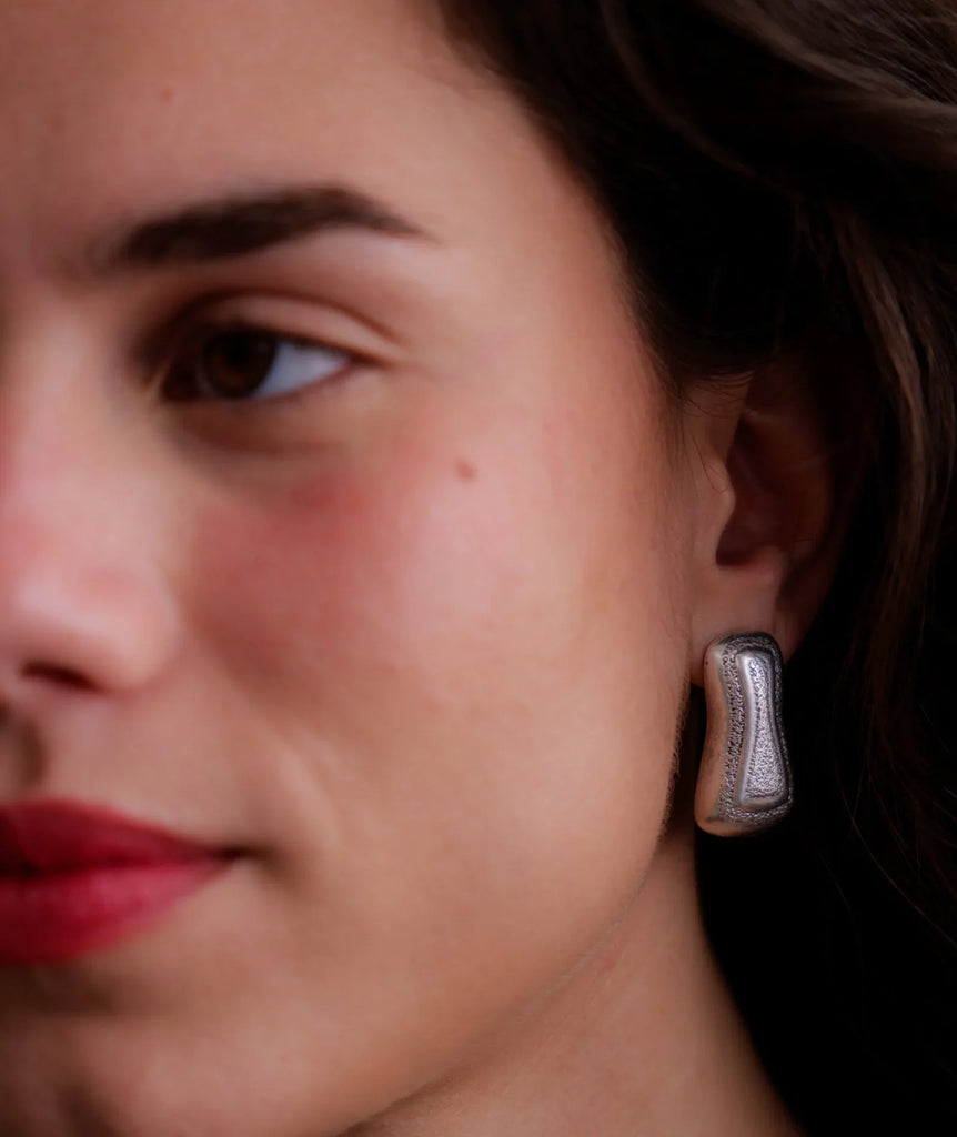 Minerva Earrings — silver textured stud on model — MYFASHIONFRUIT