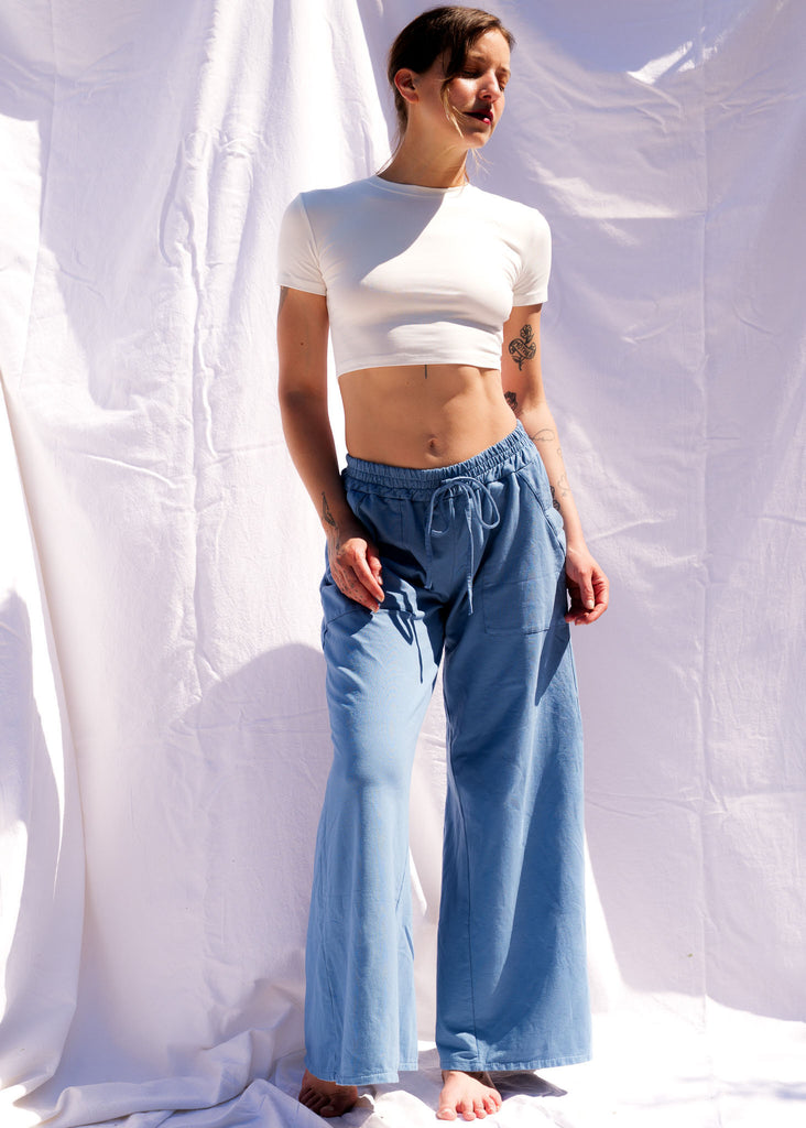 Serenity Wide Sweatpants — Blue wide leg sweatpants and white crop top on model — MYFASHIONFRUIT