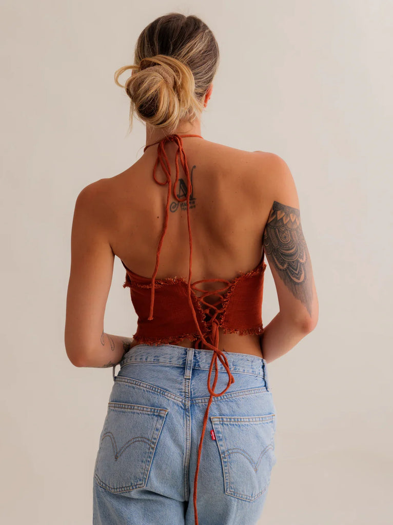 Amaya Top — Rust halter top with lace-up back on model — MYFASHIONFRUIT
