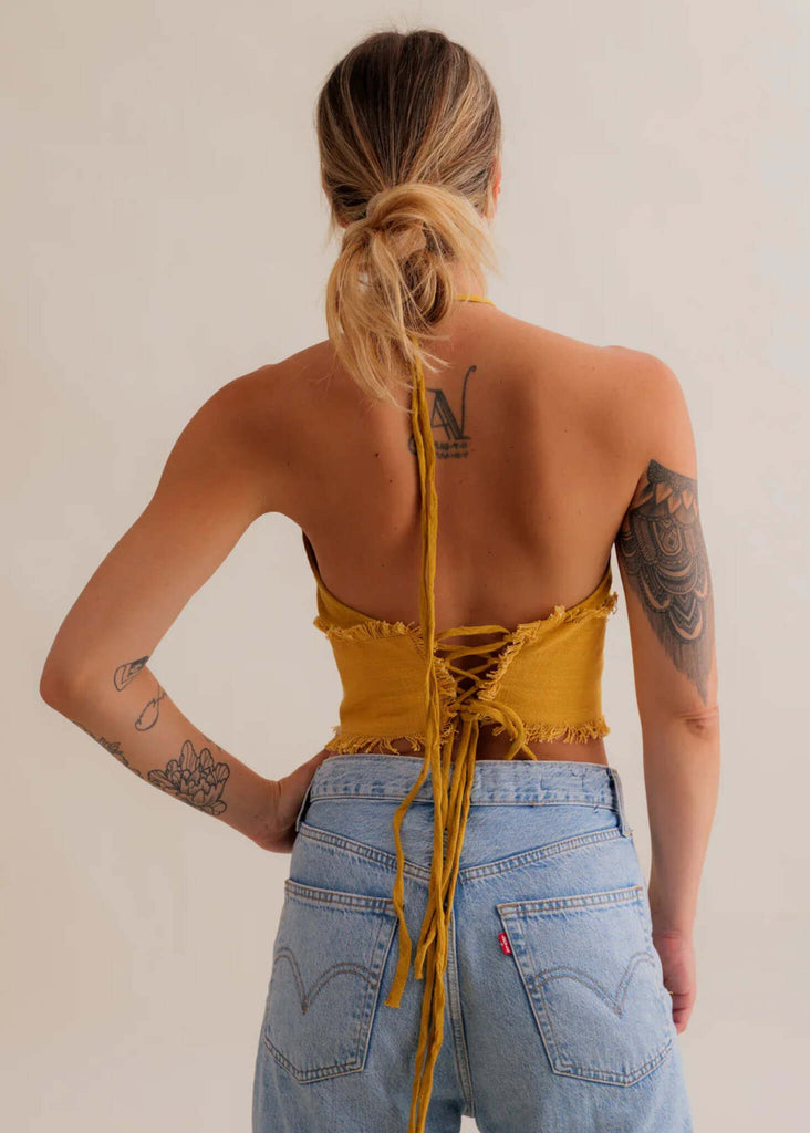 Amaya Top — Mustard yellow halter top, lace-up back, on model — MYFASHIONFRUIT
