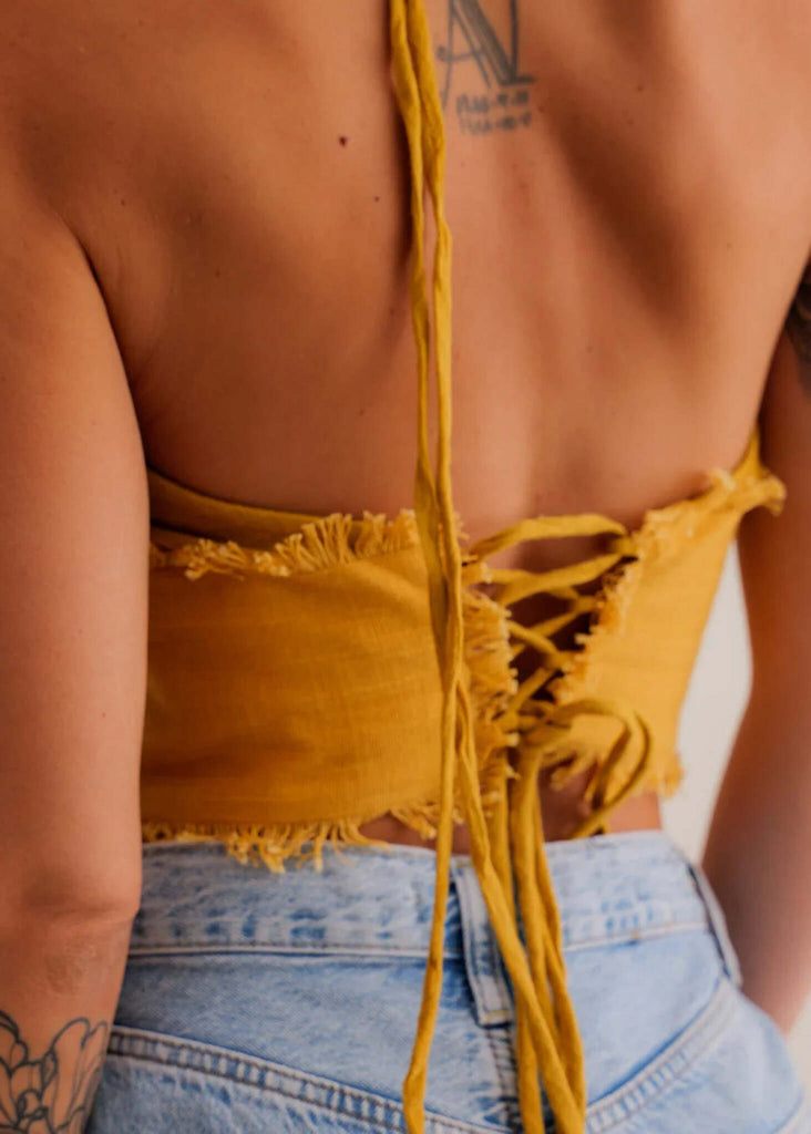 Amaya Top — Mustard-yellow top with lace-up back detail on model — MYFASHIONFRUIT