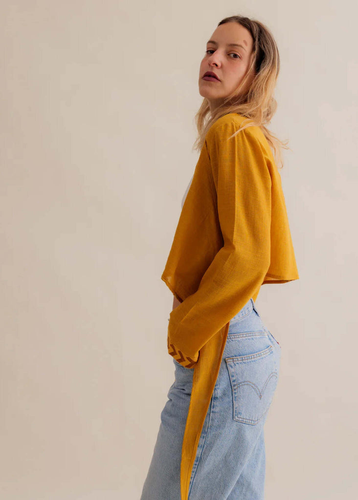 Zoe Wrap Top — Yellow linen wrap top and blue jeans on model — MYFASHIONFRUIT