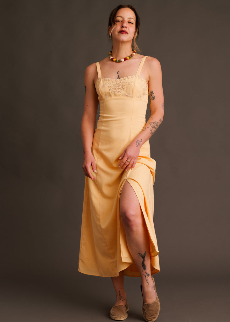 Adriana Dress — Yellow dress with side slit on model — MYFASHIONFRUIT
