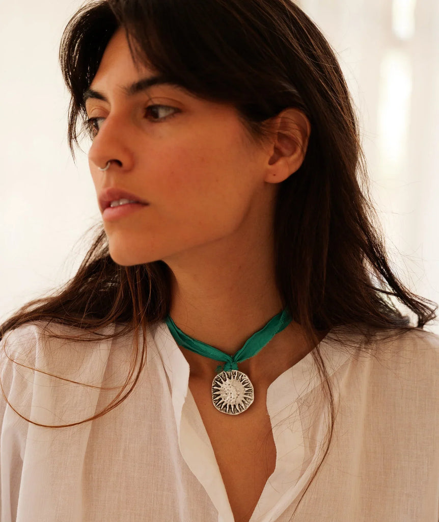 Cyra Pendant — Silver pendant on teal ribbon, on model — MYFASHIONFRUIT