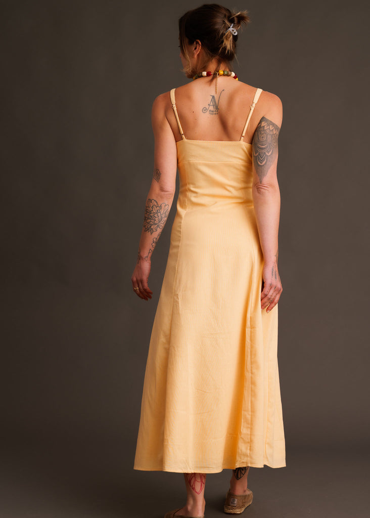 Adriana Dress — Yellow midi dress on model, back view — MYFASHIONFRUIT