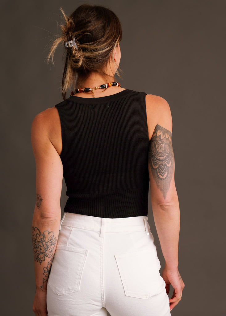 Noire Bodysuit — on model, back view, black ribbed bodysuit, white jeans — MYFASHIONFRUIT