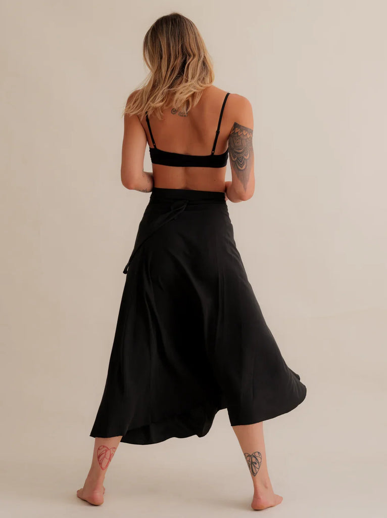 Alanis Noir Skirt — Black wrap skirt on model, back view — MYFASHIONFRUIT