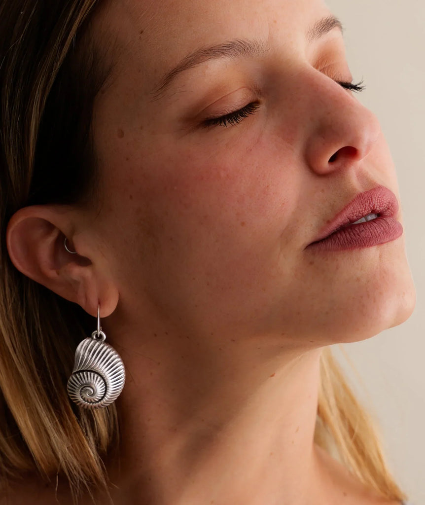 Pupu Earrings — Silver seashell earrings on model — MYFASHIONFRUIT