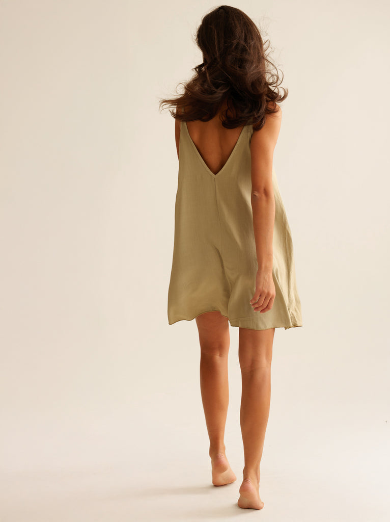 Coladas Dress — Sage green mini dress on model with deep V-back — MYFASHIONFRUIT