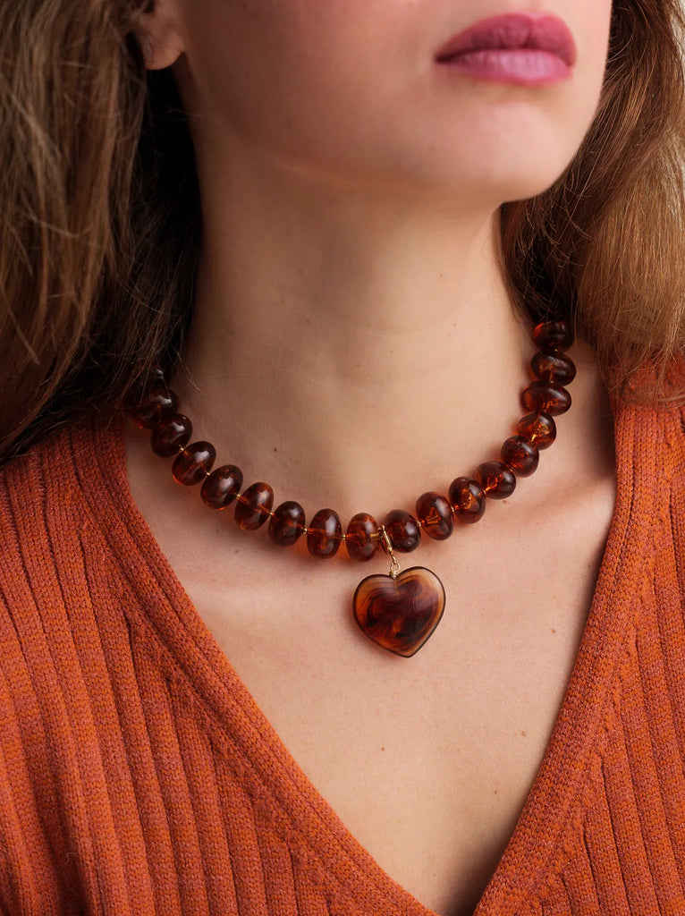 Moyo Necklace — brown beaded necklace with heart pendant on model — MYFASHIONFRUIT