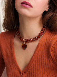 Moyo Necklace — Orange beaded necklace with heart on model — MYFASHIONFRUIT