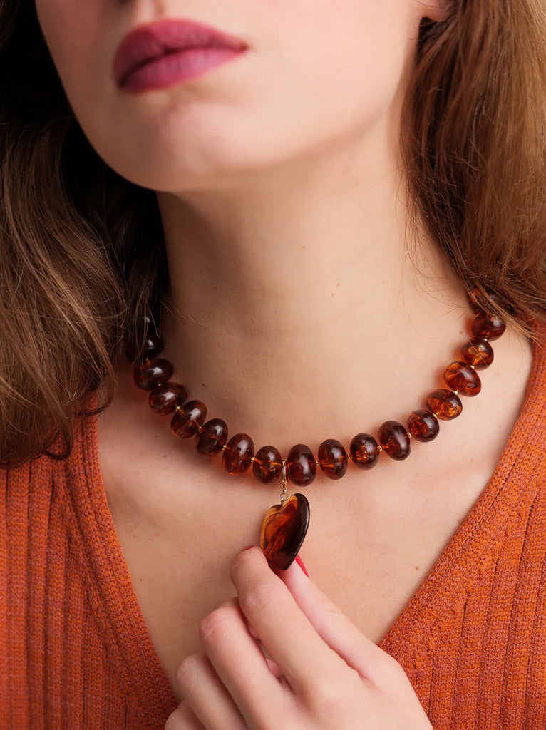 Moyo Necklace — Amber bead necklace with heart pendant on model — MYFASHIONFRUIT