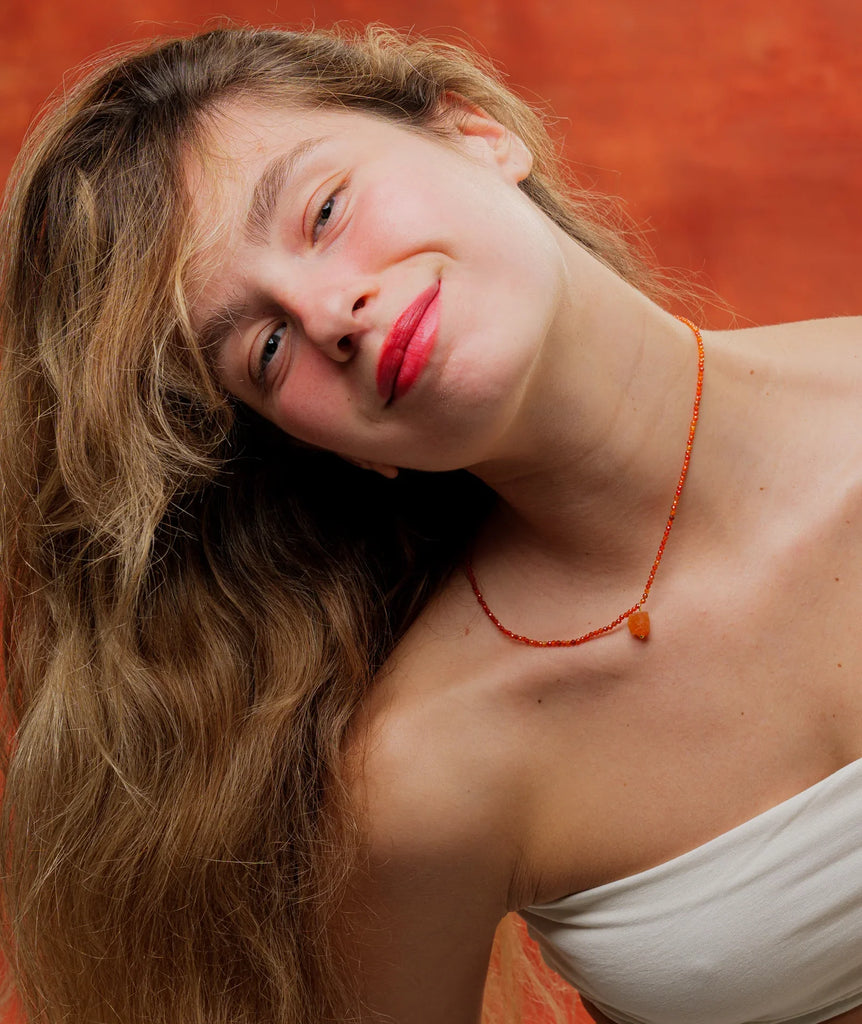 Calinda Pendant — Orange beaded necklace with pendant on model — MYFASHIONFRUIT