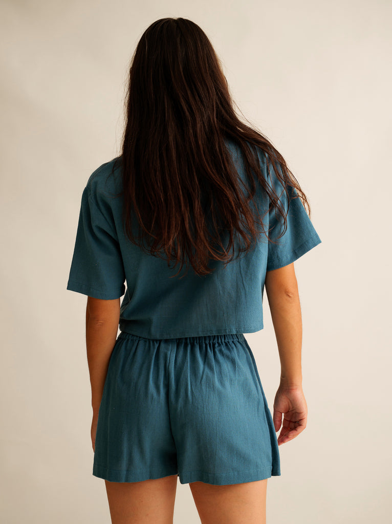 Ivey Skort — Teal top and shorts set on model, from back — MYFASHIONFRUIT