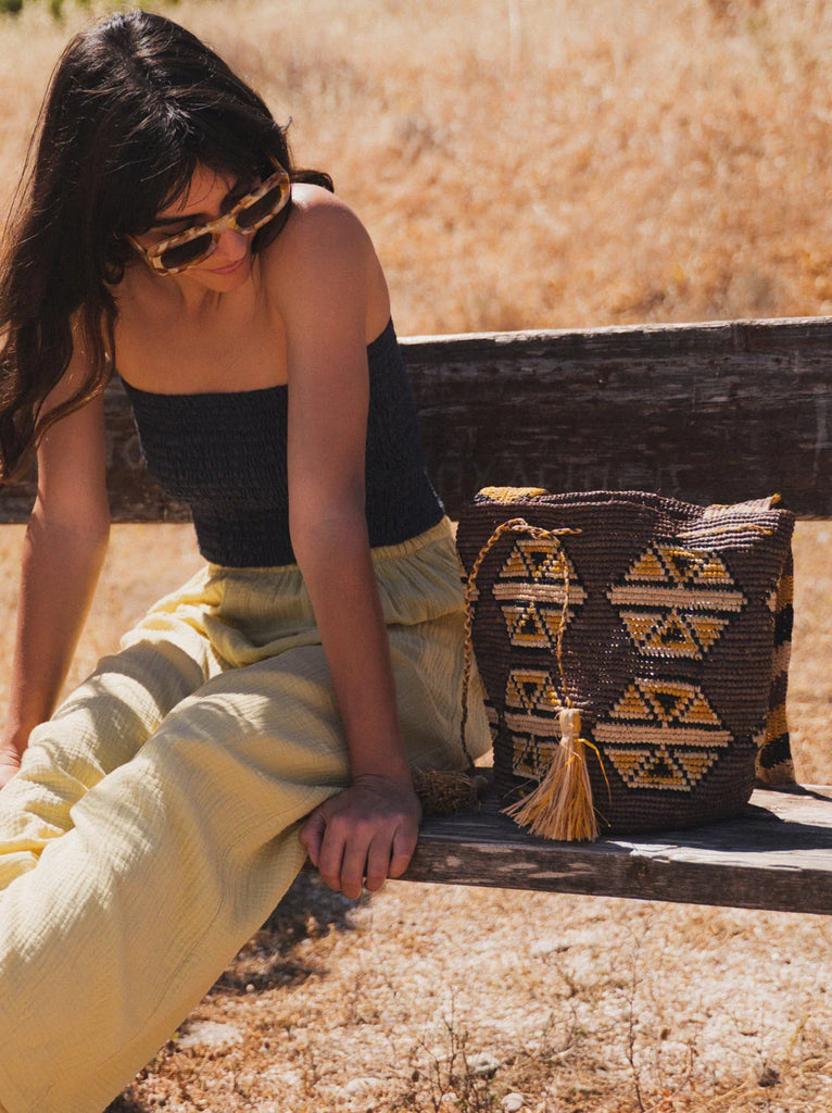 Koo Bucket Bag — woven bag with tassel on model — MYFASHIONFRUIT