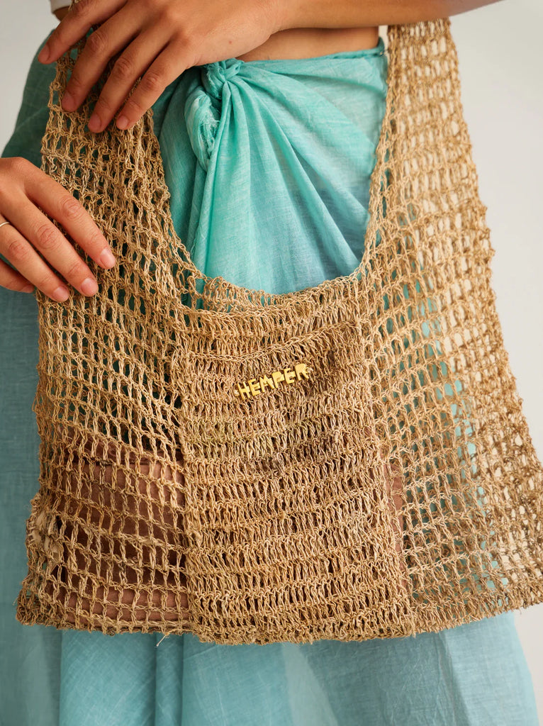 Uttara Shoulder Bag — Natural raffia net bag on model — MYFASHIONFRUIT