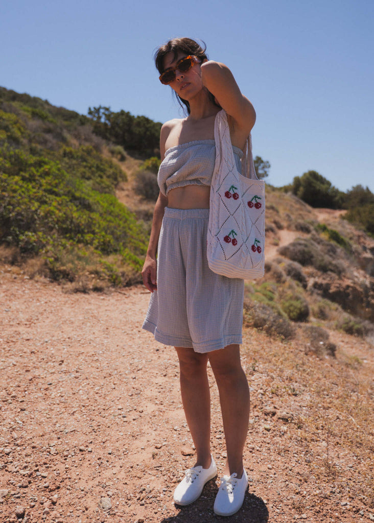 Cerise Crochet Bag — model wearing bag, matching top and shorts — MYFASHIONFRUIT