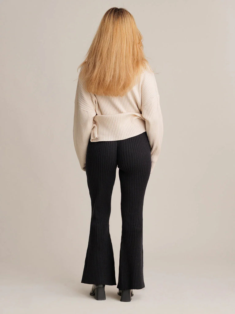 Memphis Pants — Black ribbed flares on model, rear view — MYFASHIONFRUIT