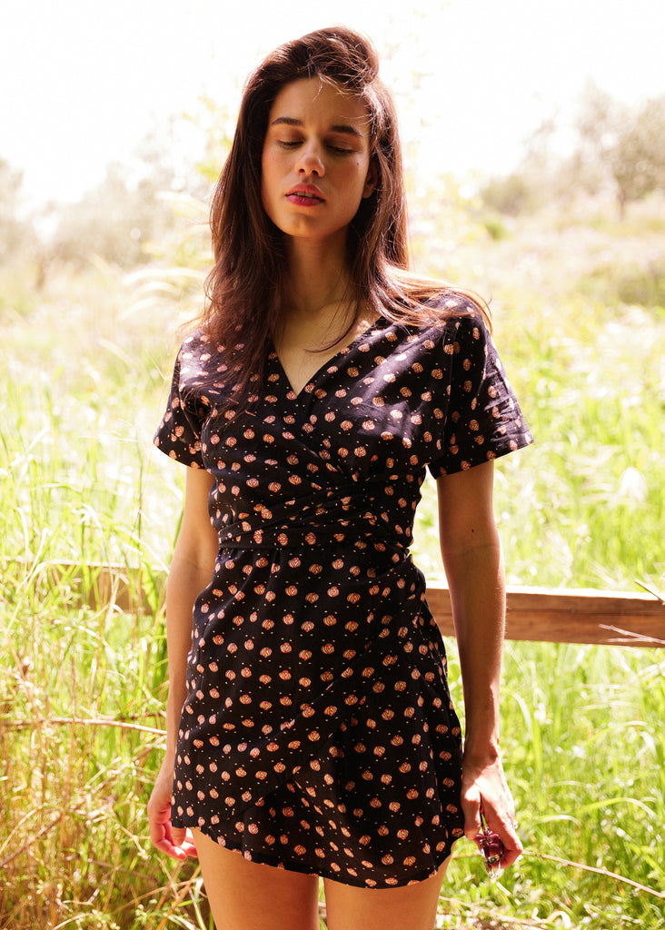 Nahla Dress — Black mini dress with tan floral print on model — MYFASHIONFRUIT