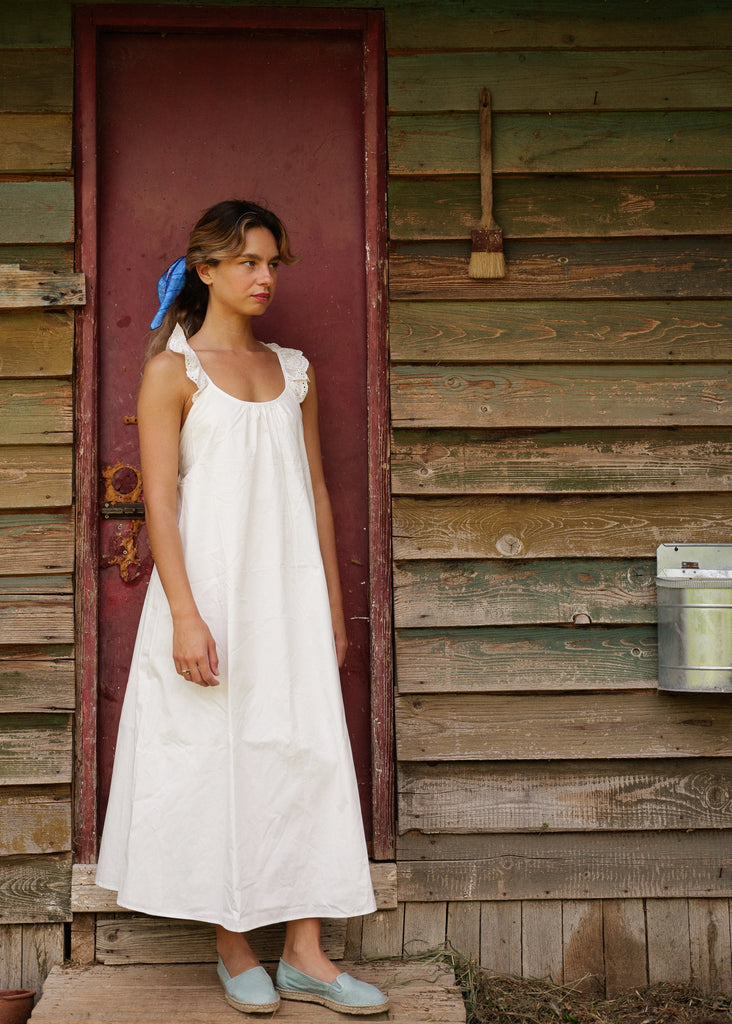 Zouzou Dress — White linen midi dress with ruffles on model — MYFASHIONFRUIT