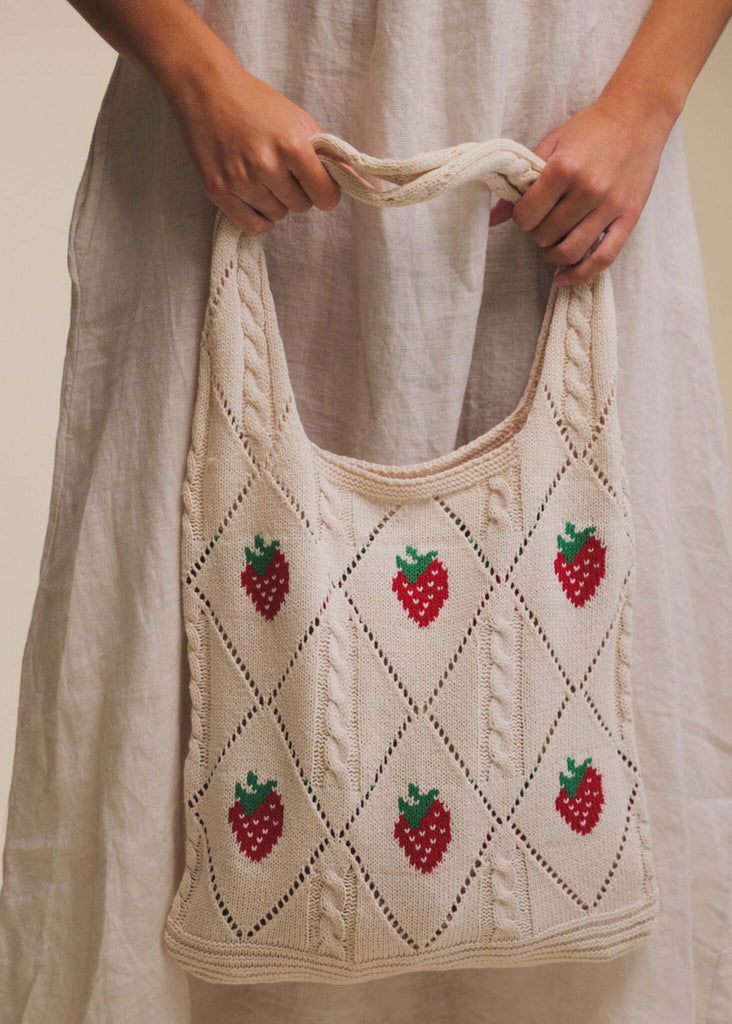 Fraise Crochet Bag — Cream knit bag with strawberries, on model — MYFASHIONFRUIT