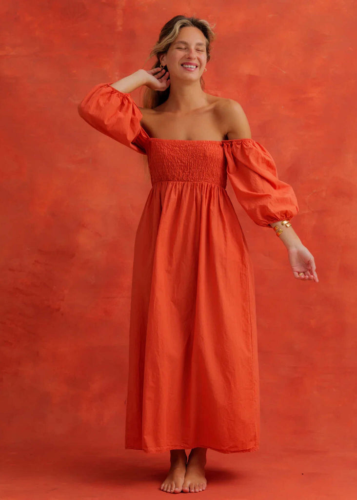Paloma Dress — Orange off-shoulder dress on a model — MYFASHIONFRUIT