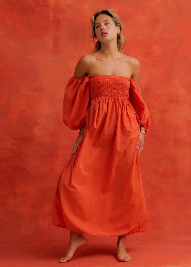 Paloma Dress — Orange off-shoulder dress with puff sleeves on model — MYFASHIONFRUIT
