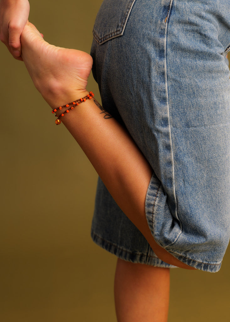 Nirvana Necklet — Orange beaded anklet on model, detail — MYFASHIONFRUIT