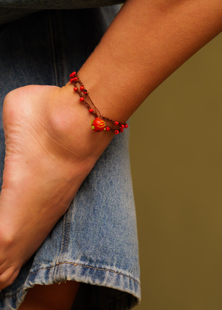Nirvana Necklet — Red beaded & charm anklet on model — MYFASHIONFRUIT