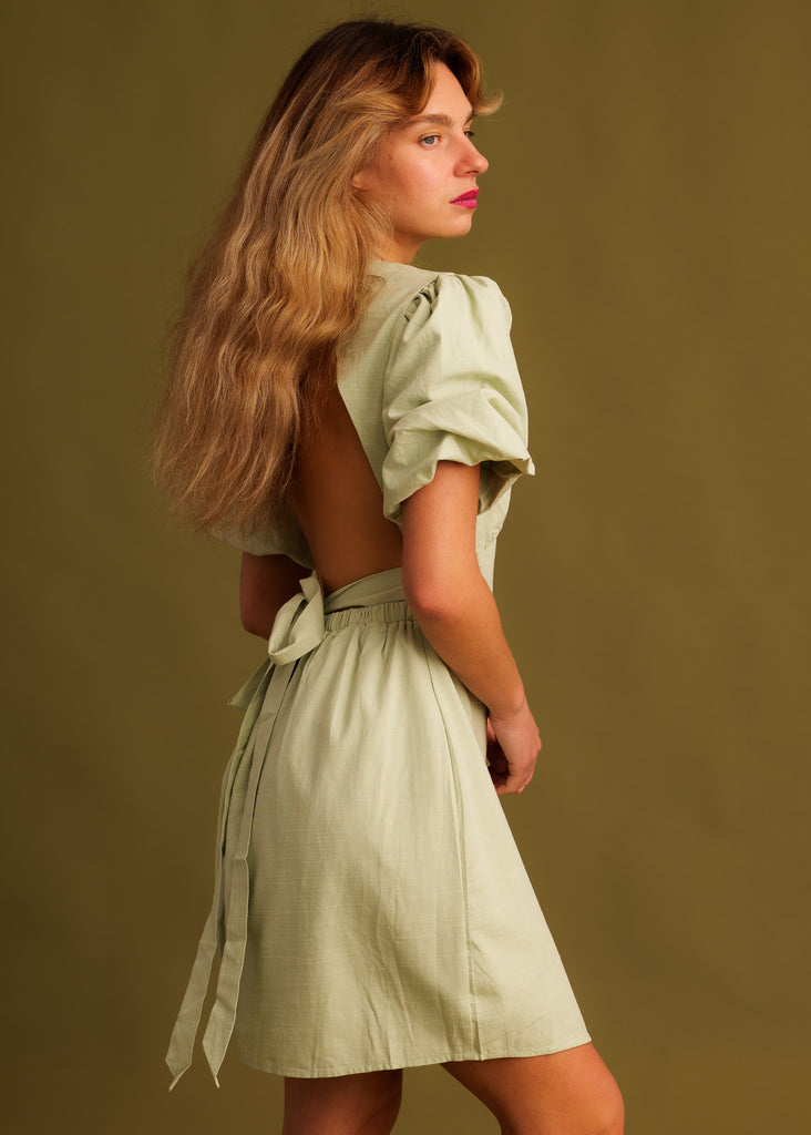 Celina Dress — Light green dress with open back on model — MYFASHIONFRUIT