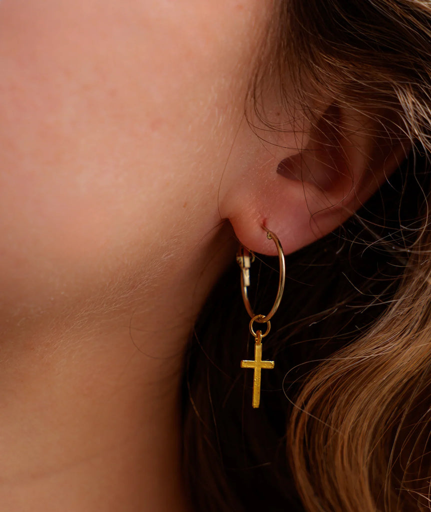 No Cross No Crown Earrings — gold hoop with cross detail on model — MYFASHIONFRUIT
