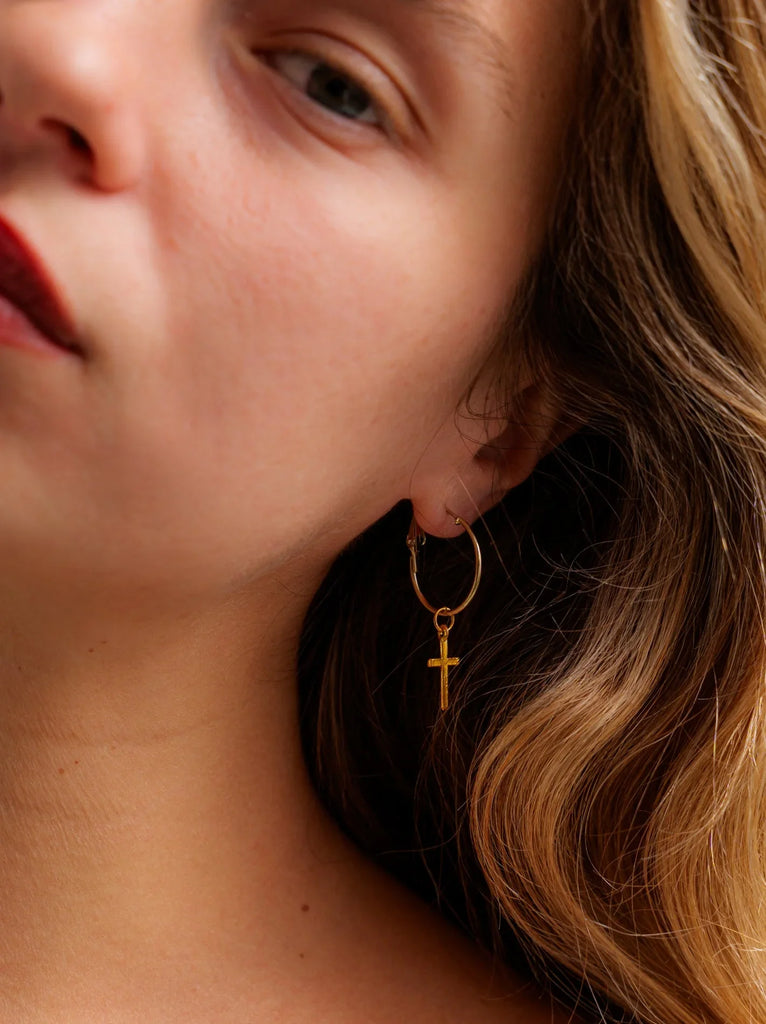 No Cross No Crown Earrings — Gold cross hoop on model — MYFASHIONFRUIT