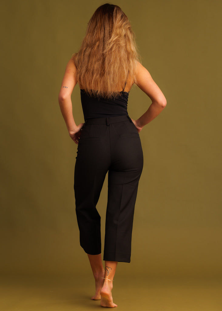 Greta Capri Pants — Black capri pants on model, back view — MYFASHIONFRUIT