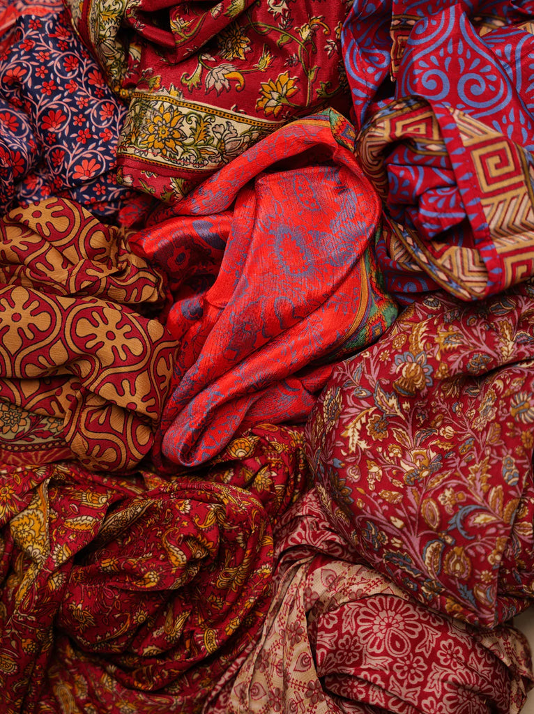 Bijal Silk Scarf - Reds — pile of patterned red silk — MYFASHIONFRUIT