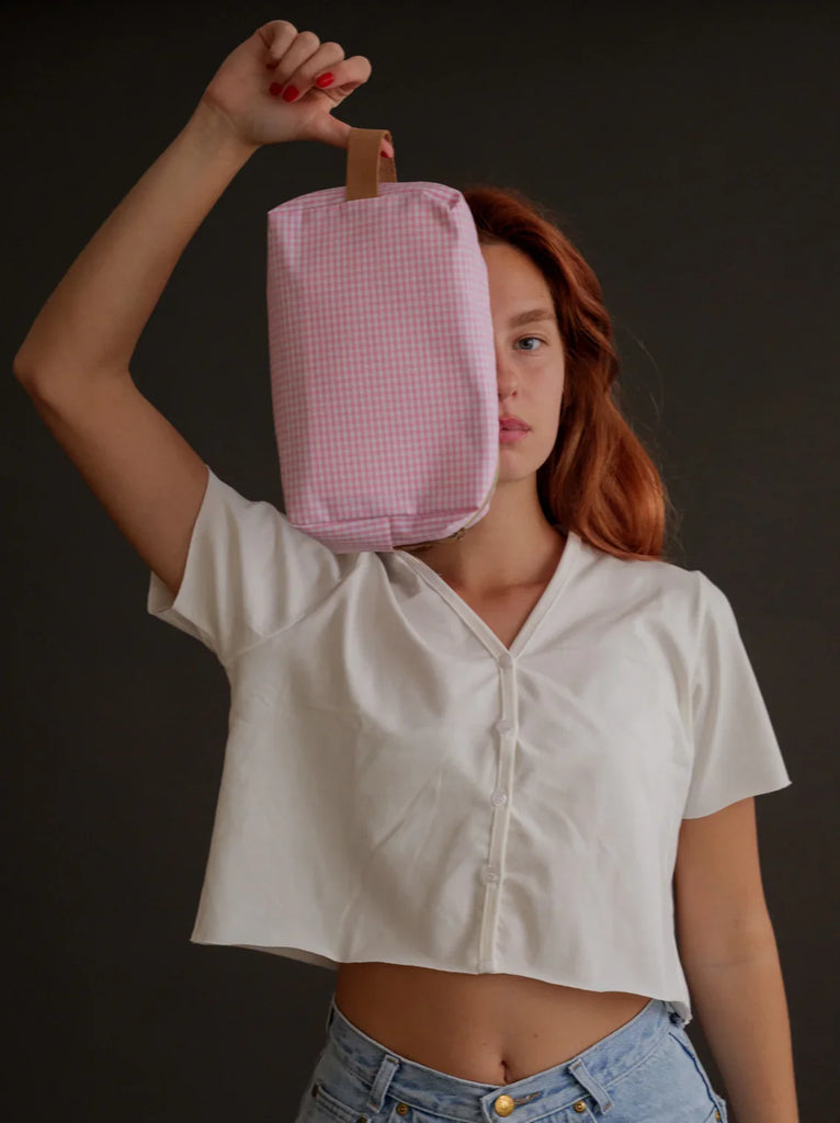 Bailey Necessaire — Pink gingham bag with handle on model — MYFASHIONFRUIT