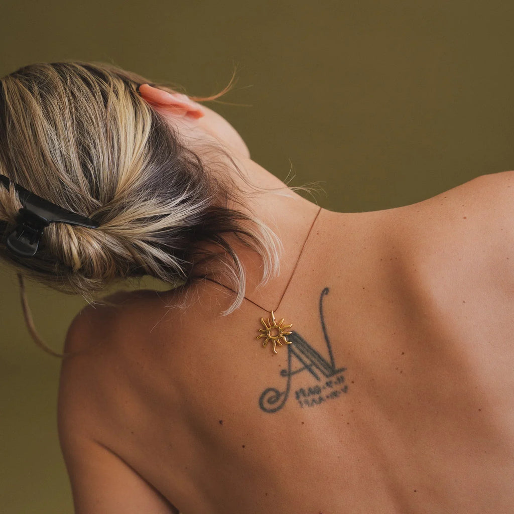 Sandya Pendant — Gold sun pendant on model — MYFASHIONFRUIT