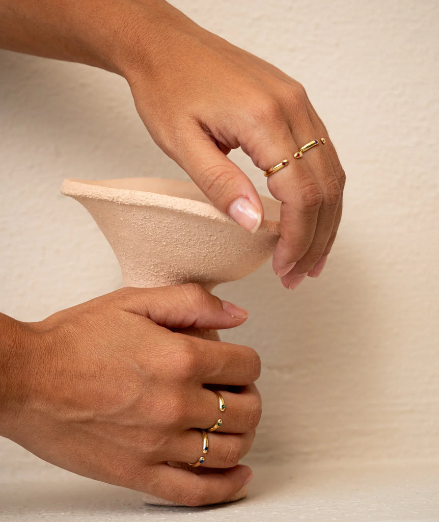 Dione Ring — Gold rings on model holding vase — MYFASHIONFRUIT