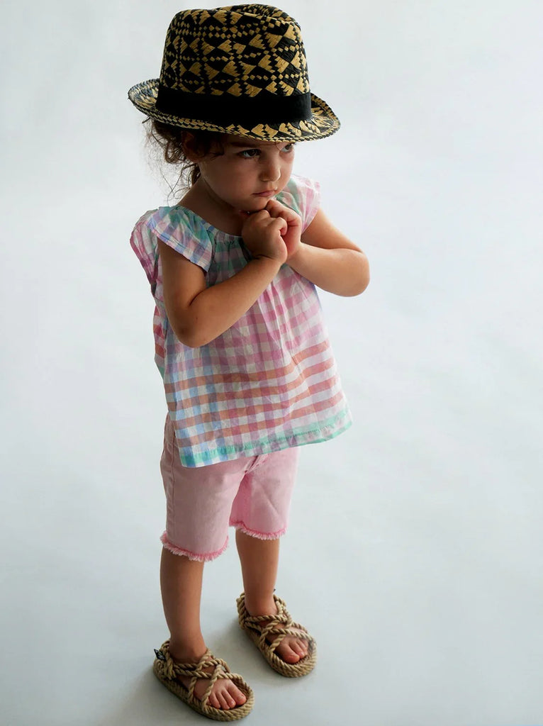 Child wearing a plaid top, pink shorts and JC Kids Camel Sandals — MYFASHIONFRUIT